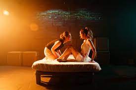 two women on a bed